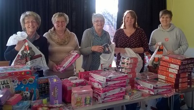 Helpers preparing Christmas toy sacks in 2014